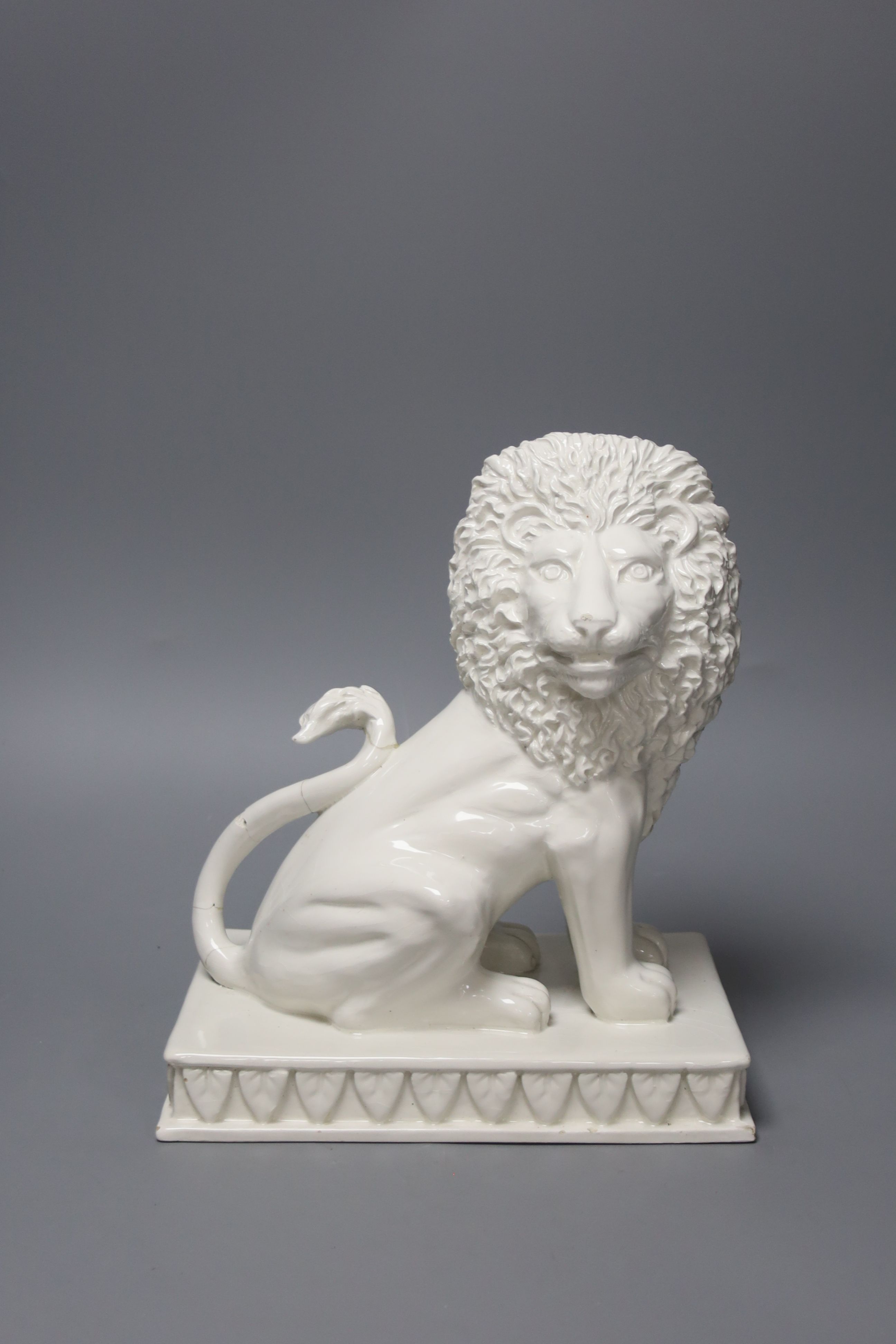 An Italian tin glazed pottery seated lion, height 25.5cm